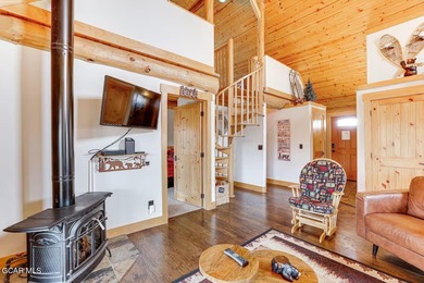 Tucked in the heart of Granby, this enchanting log cabin on Grand Elk Ranch and Club in Colorado - for sale on GolfHomes.com, golf home, golf lot