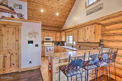 Tucked in the heart of Granby, this enchanting log cabin on Grand Elk Ranch and Club in Colorado - for sale on GolfHomes.com, golf home, golf lot