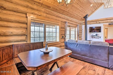 Tucked in the heart of Granby, this enchanting log cabin on Grand Elk Ranch and Club in Colorado - for sale on GolfHomes.com, golf home, golf lot