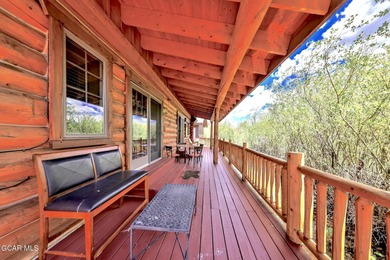 Tucked in the heart of Granby, this enchanting log cabin on Grand Elk Ranch and Club in Colorado - for sale on GolfHomes.com, golf home, golf lot