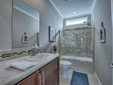 PRICE JUST IMPROVED on This Blue Coral model AND it has a WATER on Water Oak Country Club Estates in Florida - for sale on GolfHomes.com, golf home, golf lot