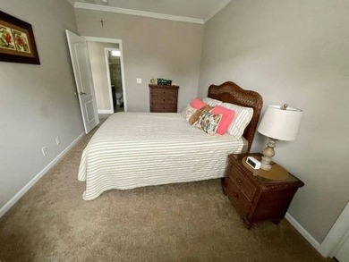 PRICE JUST IMPROVED on This Blue Coral model AND it has a WATER on Water Oak Country Club Estates in Florida - for sale on GolfHomes.com, golf home, golf lot