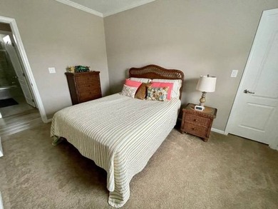 PRICE JUST IMPROVED on This Blue Coral model AND it has a WATER on Water Oak Country Club Estates in Florida - for sale on GolfHomes.com, golf home, golf lot