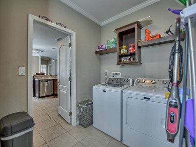 PRICE JUST IMPROVED on This Blue Coral model AND it has a WATER on Water Oak Country Club Estates in Florida - for sale on GolfHomes.com, golf home, golf lot