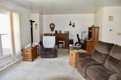 Welcome to this delightful two-bedroom, two-bath ranch-style on Sibley Golf And Country Club in Iowa - for sale on GolfHomes.com, golf home, golf lot
