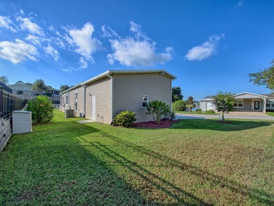 PRICE JUST IMPROVED on This Blue Coral model AND it has a WATER on Water Oak Country Club Estates in Florida - for sale on GolfHomes.com, golf home, golf lot