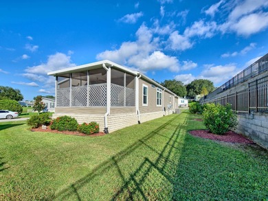 PRICE JUST IMPROVED on This Blue Coral model AND it has a WATER on Water Oak Country Club Estates in Florida - for sale on GolfHomes.com, golf home, golf lot
