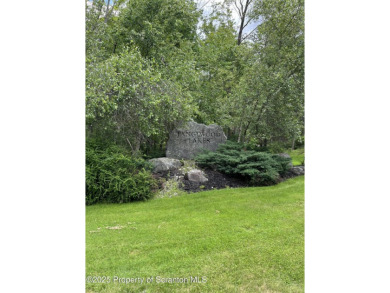 This property is sloping from the street down to the back on Paupack Hills Golf and Country Club in Pennsylvania - for sale on GolfHomes.com, golf home, golf lot