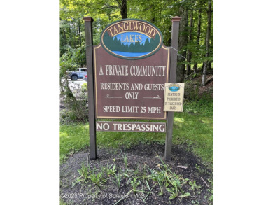 This property is sloping from the street down to the back on Paupack Hills Golf and Country Club in Pennsylvania - for sale on GolfHomes.com, golf home, golf lot