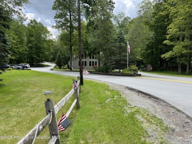 This property is sloping from the street down to the back on Paupack Hills Golf and Country Club in Pennsylvania - for sale on GolfHomes.com, golf home, golf lot