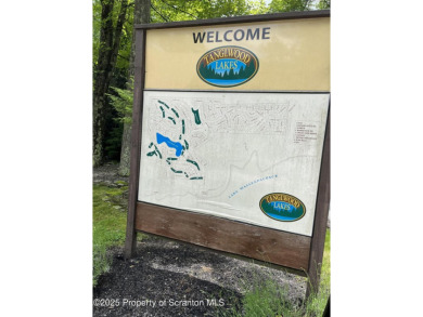 This property is sloping from the street down to the back on Paupack Hills Golf and Country Club in Pennsylvania - for sale on GolfHomes.com, golf home, golf lot