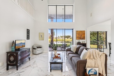 All brick two-story Eagle Harbor home with pond and fairway on Eagle Harbor Golf Club in Florida - for sale on GolfHomes.com, golf home, golf lot