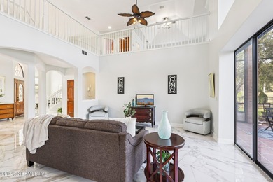 All brick two-story Eagle Harbor home with pond and fairway on Eagle Harbor Golf Club in Florida - for sale on GolfHomes.com, golf home, golf lot