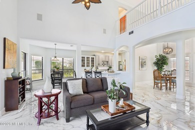 All brick two-story Eagle Harbor home with pond and fairway on Eagle Harbor Golf Club in Florida - for sale on GolfHomes.com, golf home, golf lot