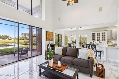 All brick two-story Eagle Harbor home with pond and fairway on Eagle Harbor Golf Club in Florida - for sale on GolfHomes.com, golf home, golf lot