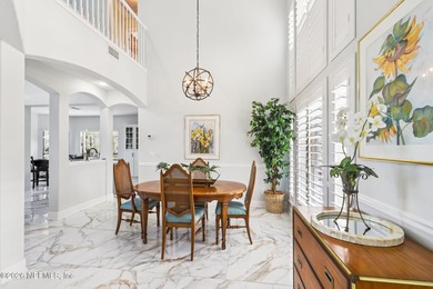 All brick two-story Eagle Harbor home with pond and fairway on Eagle Harbor Golf Club in Florida - for sale on GolfHomes.com, golf home, golf lot