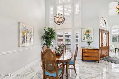 All brick two-story Eagle Harbor home with pond and fairway on Eagle Harbor Golf Club in Florida - for sale on GolfHomes.com, golf home, golf lot