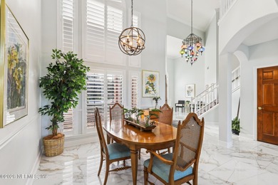 All brick two-story Eagle Harbor home with pond and fairway on Eagle Harbor Golf Club in Florida - for sale on GolfHomes.com, golf home, golf lot