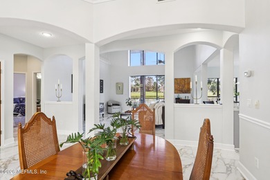 All brick two-story Eagle Harbor home with pond and fairway on Eagle Harbor Golf Club in Florida - for sale on GolfHomes.com, golf home, golf lot