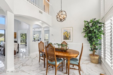 All brick two-story Eagle Harbor home with pond and fairway on Eagle Harbor Golf Club in Florida - for sale on GolfHomes.com, golf home, golf lot