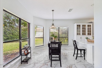 All brick two-story Eagle Harbor home with pond and fairway on Eagle Harbor Golf Club in Florida - for sale on GolfHomes.com, golf home, golf lot