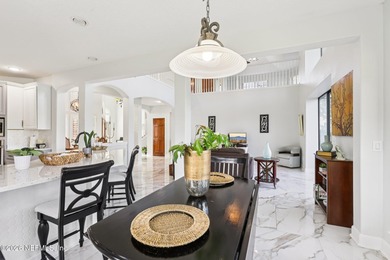 All brick two-story Eagle Harbor home with pond and fairway on Eagle Harbor Golf Club in Florida - for sale on GolfHomes.com, golf home, golf lot