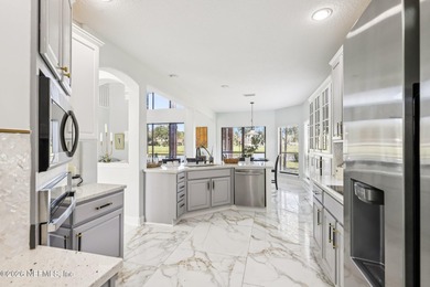 All brick two-story Eagle Harbor home with pond and fairway on Eagle Harbor Golf Club in Florida - for sale on GolfHomes.com, golf home, golf lot