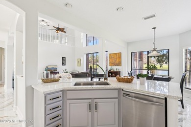 All brick two-story Eagle Harbor home with pond and fairway on Eagle Harbor Golf Club in Florida - for sale on GolfHomes.com, golf home, golf lot