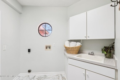 All brick two-story Eagle Harbor home with pond and fairway on Eagle Harbor Golf Club in Florida - for sale on GolfHomes.com, golf home, golf lot