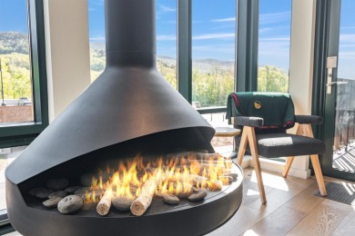 Welcome to your modern alpine retreat at Stowe's premier resort on Stowe Mountain Club in Vermont - for sale on GolfHomes.com, golf home, golf lot
