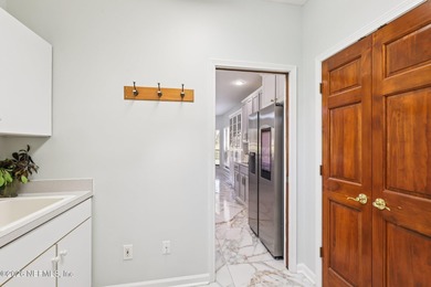 All brick two-story Eagle Harbor home with pond and fairway on Eagle Harbor Golf Club in Florida - for sale on GolfHomes.com, golf home, golf lot