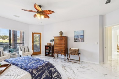 All brick two-story Eagle Harbor home with pond and fairway on Eagle Harbor Golf Club in Florida - for sale on GolfHomes.com, golf home, golf lot