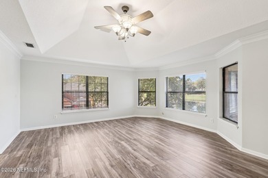 All brick two-story Eagle Harbor home with pond and fairway on Eagle Harbor Golf Club in Florida - for sale on GolfHomes.com, golf home, golf lot