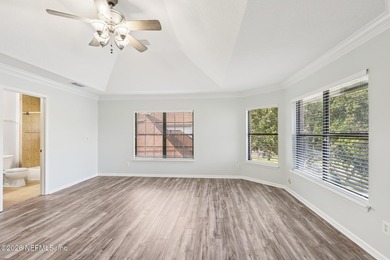 All brick two-story Eagle Harbor home with pond and fairway on Eagle Harbor Golf Club in Florida - for sale on GolfHomes.com, golf home, golf lot