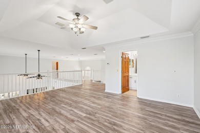 All brick two-story Eagle Harbor home with pond and fairway on Eagle Harbor Golf Club in Florida - for sale on GolfHomes.com, golf home, golf lot