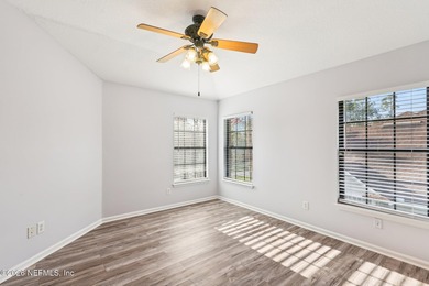 All brick two-story Eagle Harbor home with pond and fairway on Eagle Harbor Golf Club in Florida - for sale on GolfHomes.com, golf home, golf lot