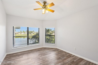 All brick two-story Eagle Harbor home with pond and fairway on Eagle Harbor Golf Club in Florida - for sale on GolfHomes.com, golf home, golf lot