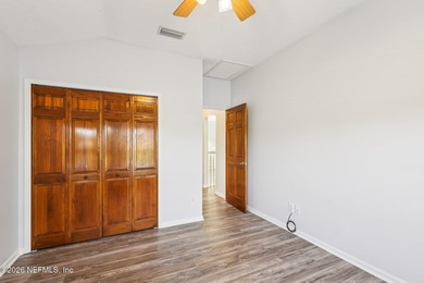 All brick two-story Eagle Harbor home with pond and fairway on Eagle Harbor Golf Club in Florida - for sale on GolfHomes.com, golf home, golf lot