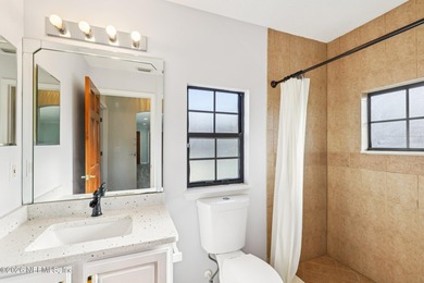 All brick two-story Eagle Harbor home with pond and fairway on Eagle Harbor Golf Club in Florida - for sale on GolfHomes.com, golf home, golf lot