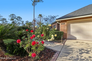 All brick two-story Eagle Harbor home with pond and fairway on Eagle Harbor Golf Club in Florida - for sale on GolfHomes.com, golf home, golf lot