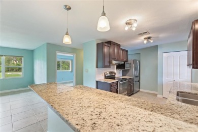 Exceptional Pool Home on 1 Acre in Indian Lake Estates - Golf on Indian Lake Estates Golf and Country Club in Florida - for sale on GolfHomes.com, golf home, golf lot