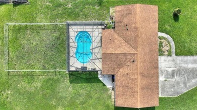 Exceptional Pool Home on 1 Acre in Indian Lake Estates - Golf on Indian Lake Estates Golf and Country Club in Florida - for sale on GolfHomes.com, golf home, golf lot