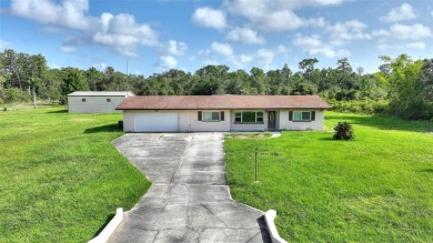 Exceptional Pool Home on 1 Acre in Indian Lake Estates - Golf on Indian Lake Estates Golf and Country Club in Florida - for sale on GolfHomes.com, golf home, golf lot