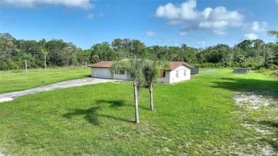 Exceptional Pool Home on 1 Acre in Indian Lake Estates - Golf on Indian Lake Estates Golf and Country Club in Florida - for sale on GolfHomes.com, golf home, golf lot