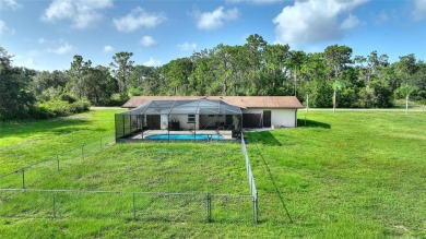Exceptional Pool Home on 1 Acre in Indian Lake Estates - Golf on Indian Lake Estates Golf and Country Club in Florida - for sale on GolfHomes.com, golf home, golf lot