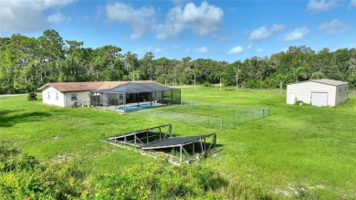 Exceptional Pool Home on 1 Acre in Indian Lake Estates - Golf on Indian Lake Estates Golf and Country Club in Florida - for sale on GolfHomes.com, golf home, golf lot