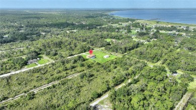 Exceptional Pool Home on 1 Acre in Indian Lake Estates - Golf on Indian Lake Estates Golf and Country Club in Florida - for sale on GolfHomes.com, golf home, golf lot
