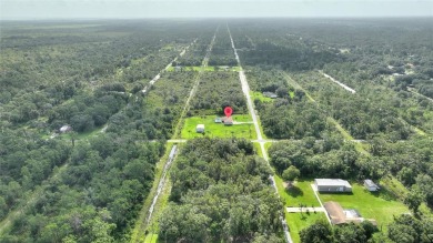 Exceptional Pool Home on 1 Acre in Indian Lake Estates - Golf on Indian Lake Estates Golf and Country Club in Florida - for sale on GolfHomes.com, golf home, golf lot