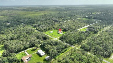 Exceptional Pool Home on 1 Acre in Indian Lake Estates - Golf on Indian Lake Estates Golf and Country Club in Florida - for sale on GolfHomes.com, golf home, golf lot