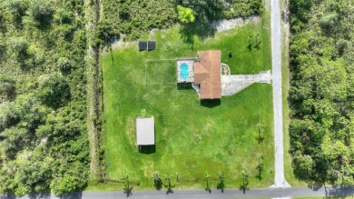 Exceptional Pool Home on 1 Acre in Indian Lake Estates - Golf on Indian Lake Estates Golf and Country Club in Florida - for sale on GolfHomes.com, golf home, golf lot